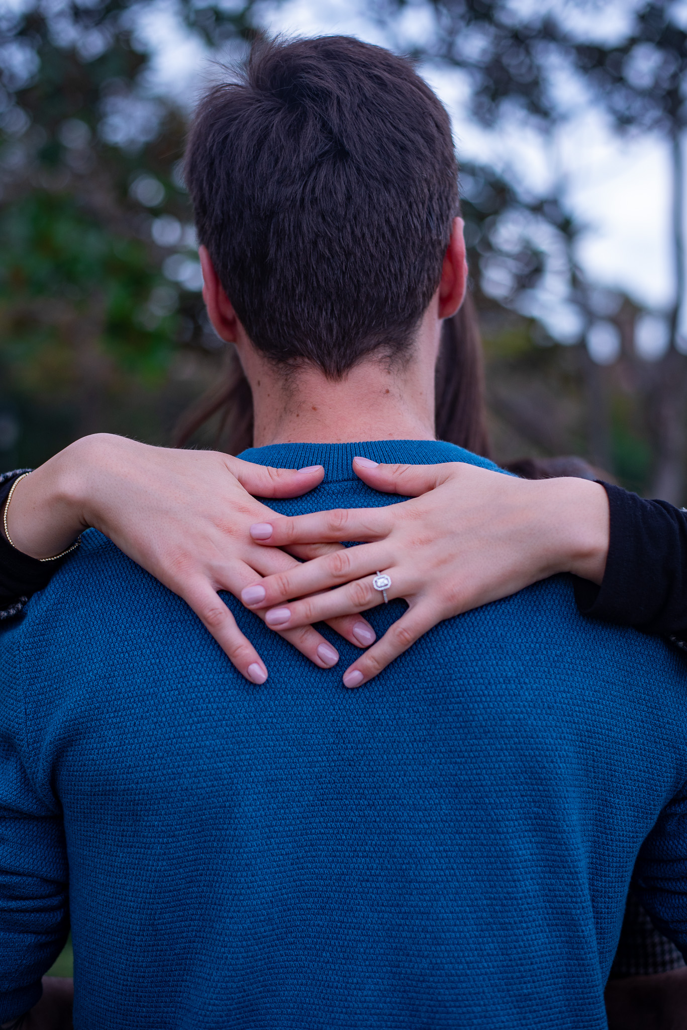 Detail shot of engagement ring on bride-to-be’s hand during a Sydney proposal photoshoot by Veros Photography